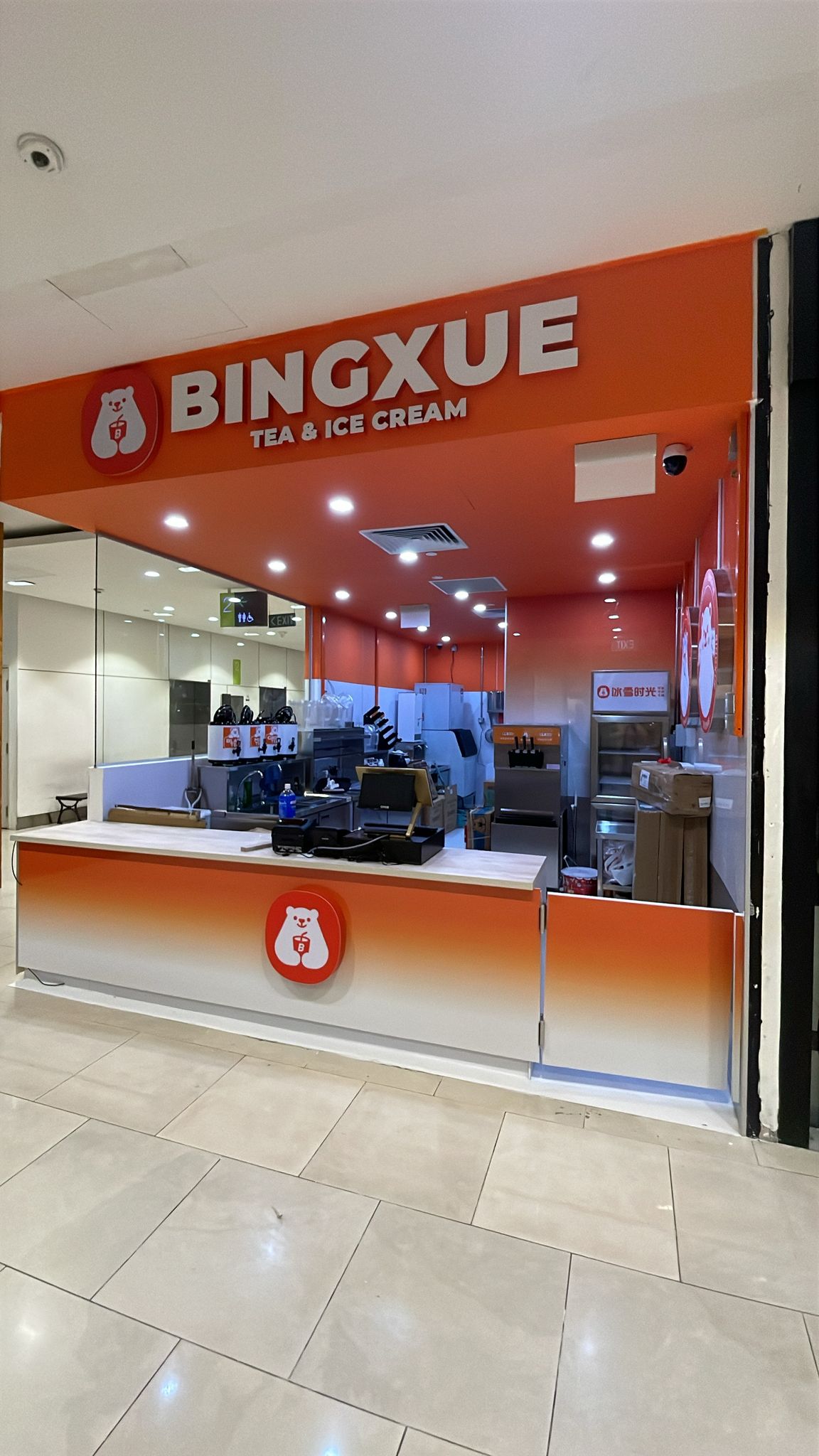 Completed Bingxue tea and ice cream kiosk fitted out by Project ER, with illuminated signage and service counter